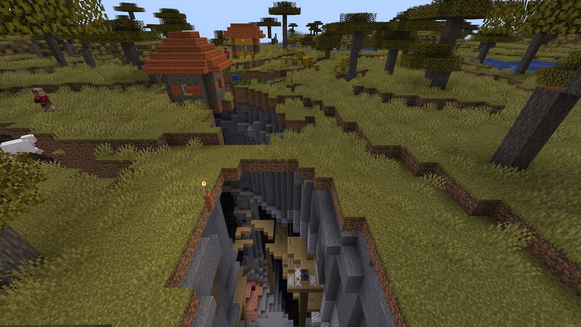 This armadillo seed's spawn village and mineshaft (Image via mojang)